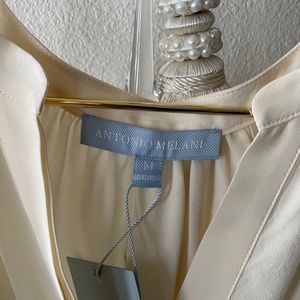 Pretty Ivory Sleeveless Blouse